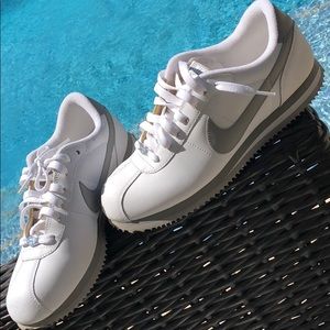 White and gray Nike sneakers